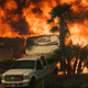 Flames consume a home on Via Arroyo as a wildfire rages in Ventura, CA on Tuesday, Dec. 5, 2017. (Image: AP/Noah Berger)